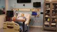 Simulation Center exam room with adult manikin.
